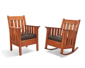 3078
An Arts & Crafts oak armchair and rocking chair
Early 20th century
Armchair with partial indecipherable label
Each with four slats to back and corbeled armrest supports, with later reupholstered leather seat cushion, one raised on rockers
2 pieces
Armchair: 38.25" H x 27.5" W x 26.25" D; Rocking chair: 34.75" H x 27.5" W x 31.5" D
Estimate: $500 - $700