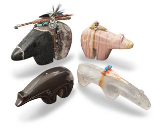 3374
Four Southwest Pueblo carved stone bear fetish figures
Mid/late 20th century
Two with unknown incised maker's marks
Comprising one selenite with inset turquoise eyes and nose accents, mounted with turquoise and shell offerings, one granite mounted with an arrow, metal turquoise, shells, and wood sticks as offerings, one pink onyx mounted with turquoise and hardstone offerings, and one pottery bear with incised details and an inset turquoise dot to the bear's back
4 pieces
Largest overall: 5.25" H x 6.375" W x 2.125" D; Shortest (selenite): 2.75" H x 6.875" W x 1.5" D
Estimate: $200 - $400