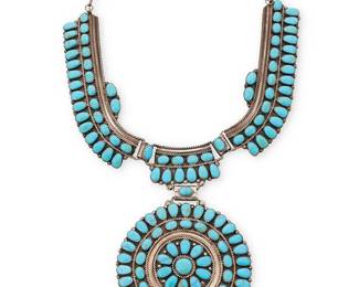 3379
A Juliana Williams & Martha Smiley Navajo silver and cluster turquoise necklace
Juliana Williams & Martha Smiley (each b. 20th century, Diné)
Late 20th century
Stamped verso: JW/MS / Sterling
A Zuni-style sterling silver and turquoise collar necklace with row-set turquoise links and a central cluster-set medallion pendant
14.5" L x 3.5" Dia.
102.1 grams gross
Estimate: $600 - $800