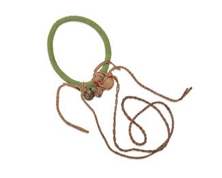 3100
A Plains beaded arm band
20th century; Great Plains
The arm band or rattle with sinew-stitched green beads and hide laces, with attached hide medicine bundle and brass-toned bells
Band: 13" inner C x 0.5" H; laces: 18.5" L
Estimate: $200 - $400