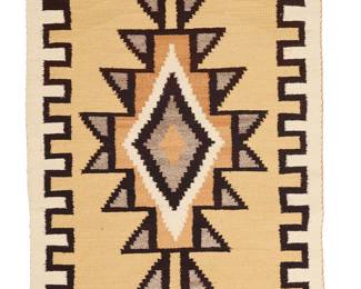 3228
A Navajo regional rug
Mid/late 20th century, Diné
Woven in cream, brown, yellow, grey, and ochre wool with a central complex stepped diamond and crenellated border, with banded ends
55" H x 38.5" W
Estimate: $200 - $300