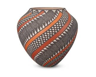 3351
Sandra Victorino (b. 1958, Acoma Pueblo)
A polychrome pottery jar, late 20th/early 21st century
Signed to underside: Sandra Victorino / Acoma, NM.
The four-color jar with swirling bands of orange and yellow between bands of black and white geometric motifs
6.375" H x 6.875" Dia.
Estimate: $300 - $500
