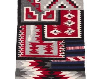 3257
A Roselinda Benally Navajo Ganado sampler textile
Roselinda Benally (b. 20th century, Diné)
Late 20th century
Woven in red, black, grey, cream and dark blue wool as a sampler of six different textile styles
29" H x 20" W
Estimate: $200 - $400