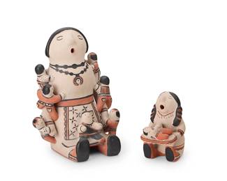 3211
Ivan & Rita Lewis (1919-2001 & 1920-1991, Cochiti Pueblo)
Two Cochiti Pueblo polychrome pottery storyteller figures, mid/late 20th century
Each variously signed to underside: Ivan Lewis / Rita Lewis / Cochiti Pueblo, N.M.
Comprising a large Ivan and Rita Lewis storyteller with eight children featuring slip painted jewelry and butterfly motifs, and a smaller Rita Lewis storyteller holding an infant
2 pieces
Larger: 8.75" H x 6" W x 6.25" D; Smaller: 4.5" H x 2.75" W x 3.25" D
Estimate: $400 - $600