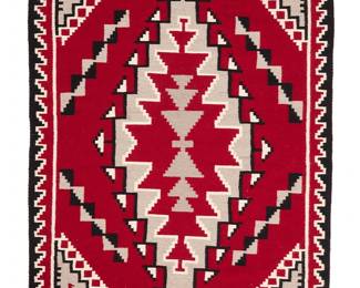 3266
A Sarah Ashie Navajo Ganado rug
Sarah Ashie (b. 20th century, Diné)
Late 20th century
Woven in red, grey, black, and cream wool with a large central stepped hooked diamond with stepped borders to sides
70" H x 50" W approximately
Estimate: $500 - $700