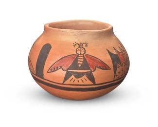 3338
Grace Chapella (1874-1980, Hopi-Tewa)
A polychrome yellowware pottery jar, 1975
Attributed and dated to underside, possibly in another hand: Grace Chapella / Sept 14, 1975
The three-color jar with brown and dark brown moth figures and stars within wave motifs to shoulder, on a cream slip ground
3.375" H x 4.875" Dia.
Estimate: $300 - $500