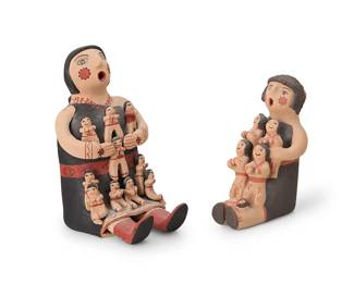 3186
Two Jemez Pueblo pottery figures
Mid/late 20th century
Each variously signed to base for artist and for Jemez Pueblo: J. Fragua / Jemez / VL / Jemez
Comprising a large polychrome pottery storyteller with ten children, and a smaller polychrome pottery storyteller with four children and an infant
2 pieces
Larger: 8.75" H x 5" W x 7" D; Smaller: 7" H x 3.5" W x 6.25" D
Estimate: $200 - $400