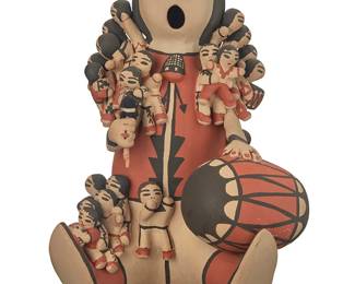 3185
Cecilia Valencia Trujillo (b. 1954, Cochiti Pueblo)
A Cochiti Pueblo polychrome pottery figure,
Signed to base: C. Valencia / Cochiti Pueblo NM
A large seated storyteller with twenty children, holding a drum and beater, and with contrast black slip geometric motifs
11.25" H x 8.25" W x 8" D approximately
Estimate: $200 - $300
