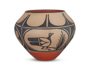 3358
Arthur & Hilda Tenorio Coriz (1948-1998 & 1949-2007, Kewa/Santo Domingo Pueblo)
A polychrome pottery jar, late 20th/early 21st century
Incised to underside: Arthur & Hilda Coriz / [artists' jar cipher]
The three-color jar with black banded bird and floral motifs on a cream slip ground, above a terracotta wash and puki indentation to underside
8.75" H x 11.125" Dia.
Estimate: $200 - $400