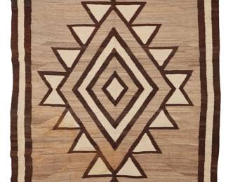 3241
A large Navajo regional rug
Early 20th century, Diné
With a central stepped diamond, woven in dark brown, natural grey, and cream wool
87.5" H x 65.5" W
Estimate: $700 - $900
