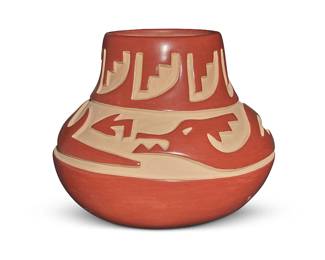 3312
Belen Tapia (1914-1999, Santa Clara Pueblo)
A redware pottery jar, late 20th century
Incised with pencil to underside: Belen Tapia / Santa Clara Pue
The jar deeply carved with tan slip painted to carved areas, depicting repeated stepped motifs to neck and an avanyu figure to shoulder
9.125" H x 11.625" Dia.
Estimate: $700 - $900
