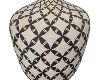 3348
Dorothy Torivio (1946-2011, Acoma Pueblo)
A geometric pottery seed jar, early 21st century
Signed to underside: Dorothy Torivio / Acoma, N.M.
With black repeated geometric motifs throughout over a white slip ground
7.5" H x 6" Dia
Estimate: $600 - $900