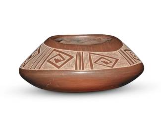 3316
Rose Naranjo & Polly Rose Folwell (1917-2004 & b. 1962, Santa Clara Pueblo)
A sienna pottery jar, late 20th century
Incised to underside: Rose Naranjo & Polly Rose
The low jar with irregular shoulder and rim, with incised angular spirals and stepped motifs in band of matte slip paint
2.875" H x 6.125" Dia.
Estimate: $200 - $400