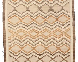 3227
A Navajo regional rug
Early 20th century, Diné
With banded serrated diamonds woven in dark brown, natural grey, cream, tan, and ochre wool
64.75" H x 49" W
Estimate: $400 - $600