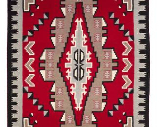 3263
A Navajo Ganado rug
Early/mid-20th century, Diné
With an elaborate central stepped diamond and intricate border, woven in red, grey, black, light brown, and cream wool
112" H x 71" W
Estimate: $800 - $1,200