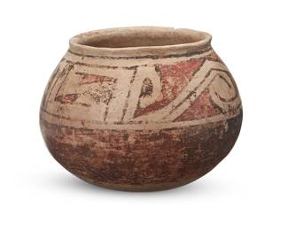 3360
A Casas Grandes polychrome pottery jar
Circa 1050-1350 CE
The three-color jar with red and brown geometric motifs on a cream slip ground above a rounded bottom
4.375" H x 5.5" Dia.
Estimate: $300 - $500