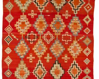 3202
A Navajo Germantown weaving
Late 19th century, Diné
Woven in red and multicolored wool featuring four rows of stepped diamonds, floating crosses and a border of stepped diamonds and decorative stitched edges to two ends
51" H x 64" W
Estimate: $5,000 - $7,000