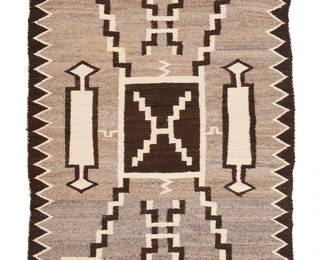 3226
A Navajo regional storm pattern rug
Mid/late 20th century, Diné
A storm pattern variant woven in natural grey/brown, dark brown, and cream wool with lightning and water bug motifs and a serrated border to sides
59" H x 38" W
Estimate: $500 - $700