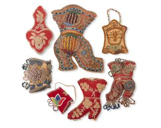 3212
A group of Haudenosaunee beaded whimseys
Late 19th/early 20th century, Iroquois; Northeastern United States/Canada
Seven works comprising a large beaded whimsey boot wall hanging, two smaller beaded whimsey boots on red fabric, two beaded whimsey wall pockets, and two beaded flap coin purses, one in red velvet and one in blue fabric
7 pieces
Largest: 9" H x 6.75" W x 2.5" D; Smallest: 2.25" H x 3.25" W x 1.5" D
Estimate: $200 - $300