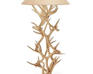 3167
A faux antler floor lamp
Mid/late 20th century
The single-light lamp raised on a column of stacked imitation antlers, surmounted by an associated paper shade, electrified
Lamp without harp: 56" H x 24" Dia., irregular; Overall: 64" H; Shade: 11.5" H x 28" Dia.
Estimate: $400 - $600