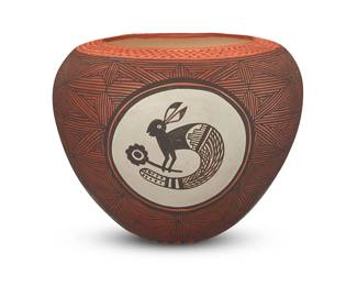 3354
Juana Leno (1917-2020, Acoma Pueblo)
A polychrome pottery jar, late 20th/early 21st century
Signed to underside: Leno / Acoma / N.M.
The three-color jar with terracotta corrugated rim above three black rabbit figures on a white slip ground in friezes within a conjoined fine-line star motif throughout
8.125" H x 10" Dia.
Estimate: $200 - $400