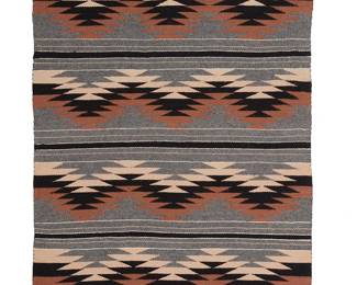 3283
A Marilyn Manhiemes Navajo regional rug
Late 20th century, Diné
Woven in grey, black, brown, tan, and white wool with alternating bands of sawtooth zigzags and striped banding
57.5" H x 39.5" W approximately
Estimate: $300 - $500
