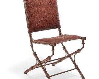 3079
A Western-style tooled leather and wrought iron chair
Mid/late 20th/early 21st century
The iron frame with antiquing/intentional oxidization and an X-form base, the seatback and seat cushion wrapped in a floral motif tooled leather
37" H x 18.5" W x 22.5" D
Estimate: $300 - $500