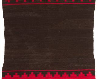 3205
A Navajo dress half weaving
Early 20th century, Diné
Woven in dark brown and red wool with wide banded ends in red featuring stepped and cross motifs
51" H x 32" W
Estimate: $800 - $1,200