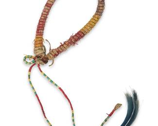 3099
A Plains quilled armband
Late 19th/early 20th century; Northern/Central Plains
A leather armband wrapped with hide lacing with multicolored quill work, with attached quilled laces with dyed horsehair dangles
Band: 11" inner C x 0.5" H; laces: 11.5" L approximately
Estimate: $200 - $400