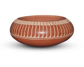 3318
Lorenzo Gonzalez (1922-1995, San Ildefonso Pueblo)
A redware pottery bowl, mid/late 20th century
Incised to underside: Lorenzo / Santa Clara Pueblo
The bowl with a band of slip-painted feather motifs to shoulder
3.25" H x 7.625" Dia.
Estimate: $200 - $400