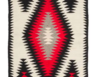 3279
A Navajo regional rug
Mid/late 20th century, Diné
Woven in white, red, grey, and cream wool with a large central serrated diamond and four floating diamonds, with black serrated borders to sides
58" H x 29" W
Estimate: $200 - $300