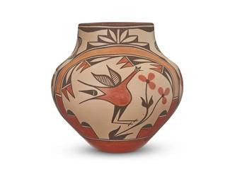 3366
Elizabeth Toya Medina (b. 1956, Jemez/Zia Pueblo)
A polychrome pottery jar, circa 1985
Signed in felt ink to underside: Elizabeth Medina / Zia
The four-color jar with orange, red, and brown roadrunner and foliate motifs on a cream slip ground, above a terracotta wash
10.75" H x 11" Dia.
Estimate: $500 - $700