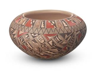 3344
Rondina Huma (b. 1947, Hopi-Tewa)
A polychrome pottery jar, late 20th century
Faintly signed and inscribed to underside: Rondina Huma / Tewa / Polacca Az
The three-color jar with red and brown swirling bands of geometric and stepped motifs on a cream slip ground
2.625" H x 4.625" W
Estimate: $300 - $500