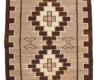 3239
A Navajo Two Grey Hills rug
Early 20th century, Diné
With conjoined stepped diamonds and floating figural motifs within a denticulated border, woven in dark brown, cream, natural grey, and ochre wool
83.5" H x 55.5" W
Estimate: $600 - $800