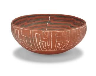 3362
A large Gila/Southwest polychrome pottery dough bowl
Circa 14th/15th century or later
The red clay bowl decorated with black geometric stacks to interior and white geometric pattern to exterior
6" H x 13" Dia.
Estimate: $100 - $200