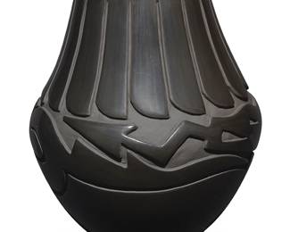 3302
Vicky Martinez Tafoya (b. 1967, Santa Clara Pueblo)
A blackware pottery jar, early 21st century
Incised to underside: Vicky Mrtz Tafoya / Santa Clara Pueblo
With deeply carved Avanyu motif to the body and banded feather motif to neck, with slip paint to carved areas
11.75" H x 10" Dia.
Estimate: $400 - $600