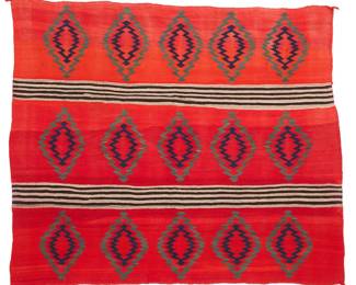 3193
A Navajo Transitional woman's wearing blanket
Late 19th century, Diné
With alternating bands and rows of serrated diamonds, woven in red, natural grey, dark brown, blue, and blue/green wool
43.5" H x 51.5" W
Estimate: $4,000 - $6,000