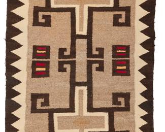 3230
A Navajo regional rug
Early 20th century, Diné
A textile woven in grey, brown, cream, and red wool with conjoined hooked crosses and a sawtooth border
45.5" H x 25.25"W
Estimate: $200 - $400