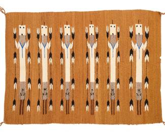 3182
A Navajo Yei weaving
Mid/late 20th century, Diné
Woven in cream, black, grey, blue, and ochre with six standing Yei figures each holding feather strands
33.5" H x 45.75" W
Estimate: $300 - $500