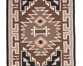 3250
A Mary "Little Water" Henderson Navajo Two Grey Hills rug
Mary "Little Water" Henderson (b. 20th century, Diné)
Mid/late 20th century
With a serrated central diamond and geometric motifs throughout, woven in black, cream, natural grey, dark brown, and light brown wool
49.75" H x 35.25" W
Estimate: $300 - $500