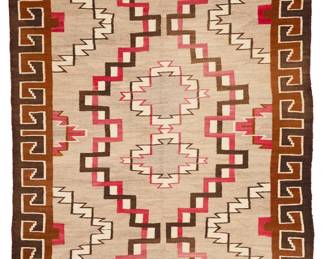 3238
A Navajo Ganado rug
Early 20th century, Diné
With three conjoined latticed diamonds and an elaborate hooked long border, woven in red, cream, natural grey, orange/brown, and dark brown wool
103.5" H x 53" W
Estimate: $700 - $900