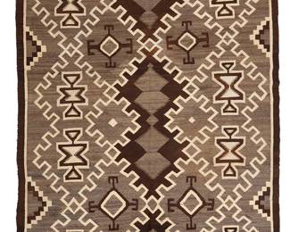 3240
A Navajo Two Grey Hills rug
Early 20th century, Diné
With rows of denticulated diamonds and floating hooked and geometric elements, woven in dark brown, cream, and natural grey wool
81.75" H x 61" W
Estimate: $700 - $900
