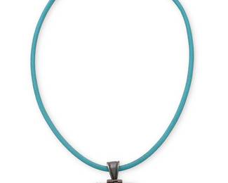 3386
A Southwest-style sterling silver and gem set necklace
Late 20th century
Stamped 925
A square pendant necklace set with multicolor stones on a turquoise leather cord
2 pieces
16" L x 1.75" H
18.1 grams gross
Estimate: $300 - $500