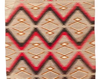 3222
A Navajo regional rug
Early 20th century, Diné
With alternating bands of red and black serration woven in red, cream, grey, and black wool
68.5" H x 47.5" W
Estimate: $500 - $700