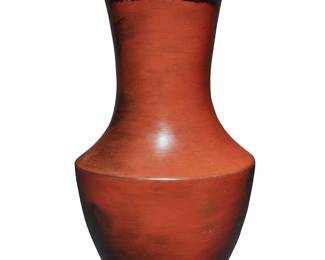 3325
Susie Crank (b. 1966, Navajo/Diné)
A tall redware pottery vase, late 20th/early 21st century
Incised to underside: Susie W. Crank / Navajo
With stylized fire clouding throughout, featuring a braided rope-form band to upper neck in relief
11.625" H x 6.5" Dia.
Estimate: $200 - $400