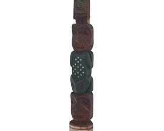 3296
A Northwest Coast polychrome totem
Mid-20th century
Unmarked
The small painted carved cedar standing totem depicting two figures and a frog, with an eagle to the top
19.5" H x 3.75" W x 2.375" D
Estimate: $300 - $500