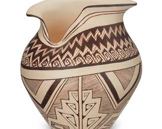 3332
Delaine "Dee" Tootsie-Chee (b. 1962, Hopi-Tewa)
A shaped rim pottery jar, early 21st century
Signed and inscribed to underside: D. Tootsie / ASAH / [roadrunner cipher] / Hopi
The jar with brown bands of sawtooth and swirling motifs to shoulder, and fine-line and stacked arrows to body, over a white slip ground
9.5" H x 8.5" Dia.
Estimate: $300 - $500