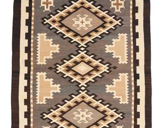 3248
A Navajo Two Grey Hills rug
Early/mid-20th century, Diné
With three central stylized stacked diamonds and a denticulated border, woven in natural grey, cream, dark brown, and light brown wool
73" H x 51" W
Estimate: $600 - $900
