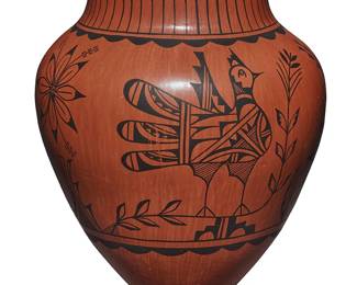 3365
Christine Tosa (b. 1950, Jemez Pueblo)
A large redware pottery vase, late 20th/early 21st century
Incised to underside: C. Tosa / Jemez / N.M.
With black banded feather motifs to neck above chicken figures and floral motifs to body, over a burnished red slip ground
14" H x 12.5" Dia.
Estimate: $200 - $300