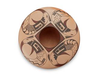 3335
Ramon Tahbo Howato (b. 1978, Hopi-Tewa)
A polychrome pottery flat shouldered jar, early 21st century
Signed to underside: Ramon Tahbo Howato / [artist's cipher]
The three-color jar with four red and black swirling bird-forms filled in with geometric motifs
4.125" H x 8.25" Dia.
Estimate: $200 - $400